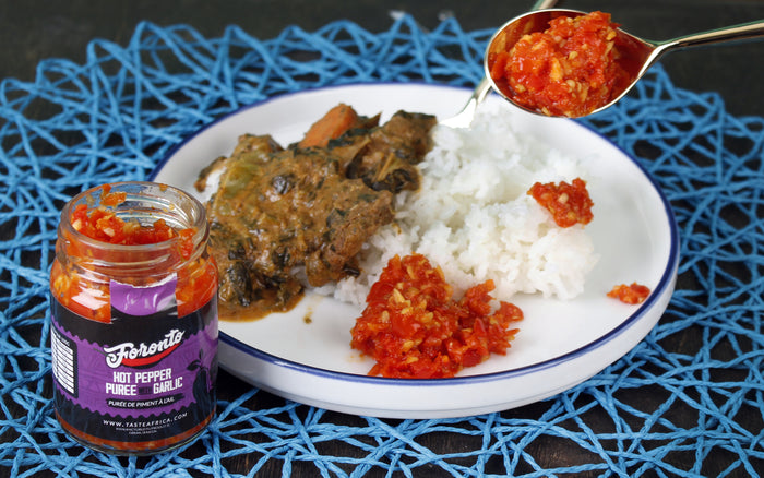 Taste Africa meal served with rice and Foronto Hot Chili Puree